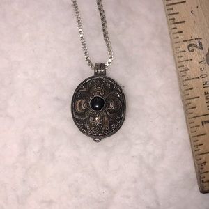 Poison your ex lover.  Intricate flur-de-lis design with copper and amethyst.